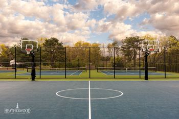 Tennis courts with basketball court in foreground